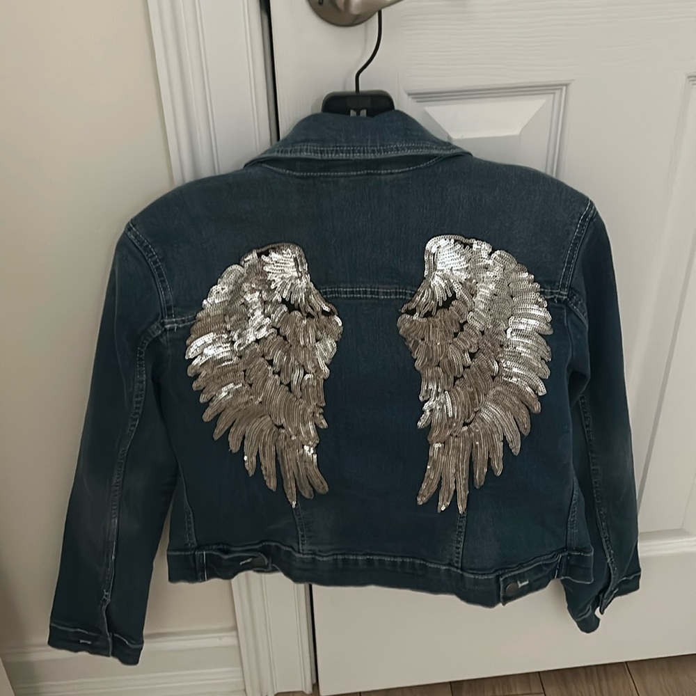 Venus Angel Wings jean jacket. Size 8. Like new. Never worn. No tags.